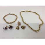 Two 9ct gold rope twist chains, three lockets and pair 9ct gold mounted purple stone screw back earr