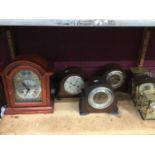 Collection of seven bracket and mantel clocks, and a collection of horology magazines