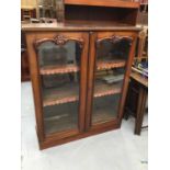 Victorian mahogany bookcase with two glazed doors enclosing three adjustable shelves 110 cm wide, 12