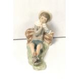 Lladro Figure of Boy Lying Down with Bird Dimensions: 22cm L x 16cm H