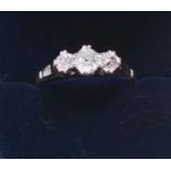 18 CT Gold & Platimum 3 Stone Diamond Ring, Comprising of 1 Oval Shaped Diamond , Flanked by a