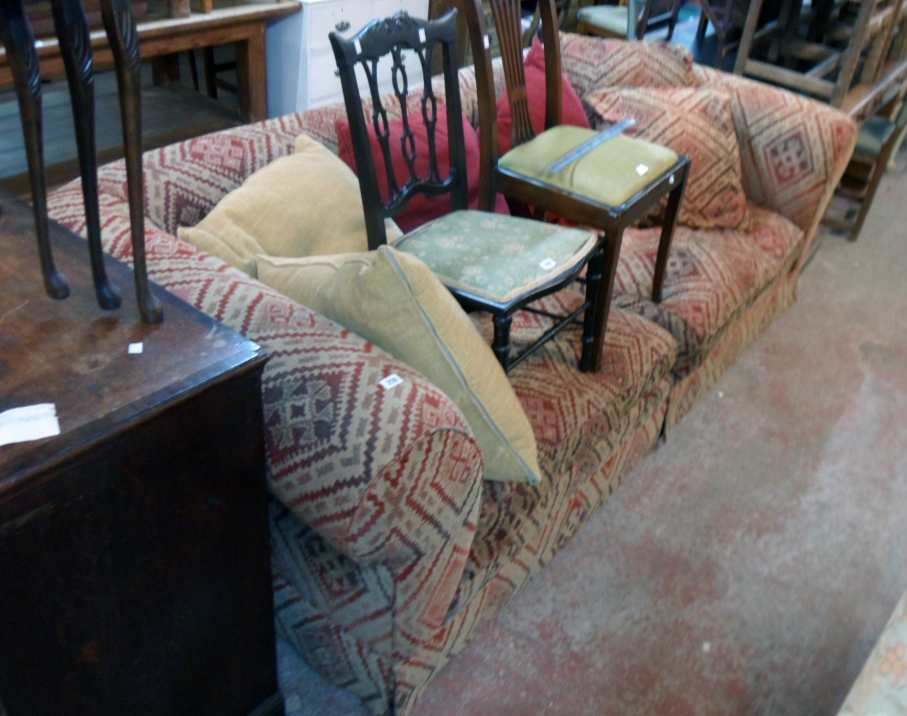 An 8' 8" modern Chesterfield two section settee upholstered in repeat pattern tapestry, with six