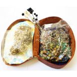 A leather case containing costume jewellery necklaces, assorted hat-pins and white metal jewellery