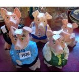 A set of five Nat West piggy banks