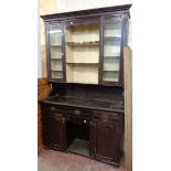 A 4' 6" Victorian stained pine two part dresser with three central scalloped shelves and flanking