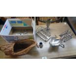 A small quantity of silver plated items including two toast racks, also wicker bottle carrier