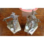 A pair of spelter figures of a jester and a lady, set on alabaster bases