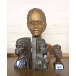 An African carved wood bust of a woman and a smaller similar - sold with a pair of bookends