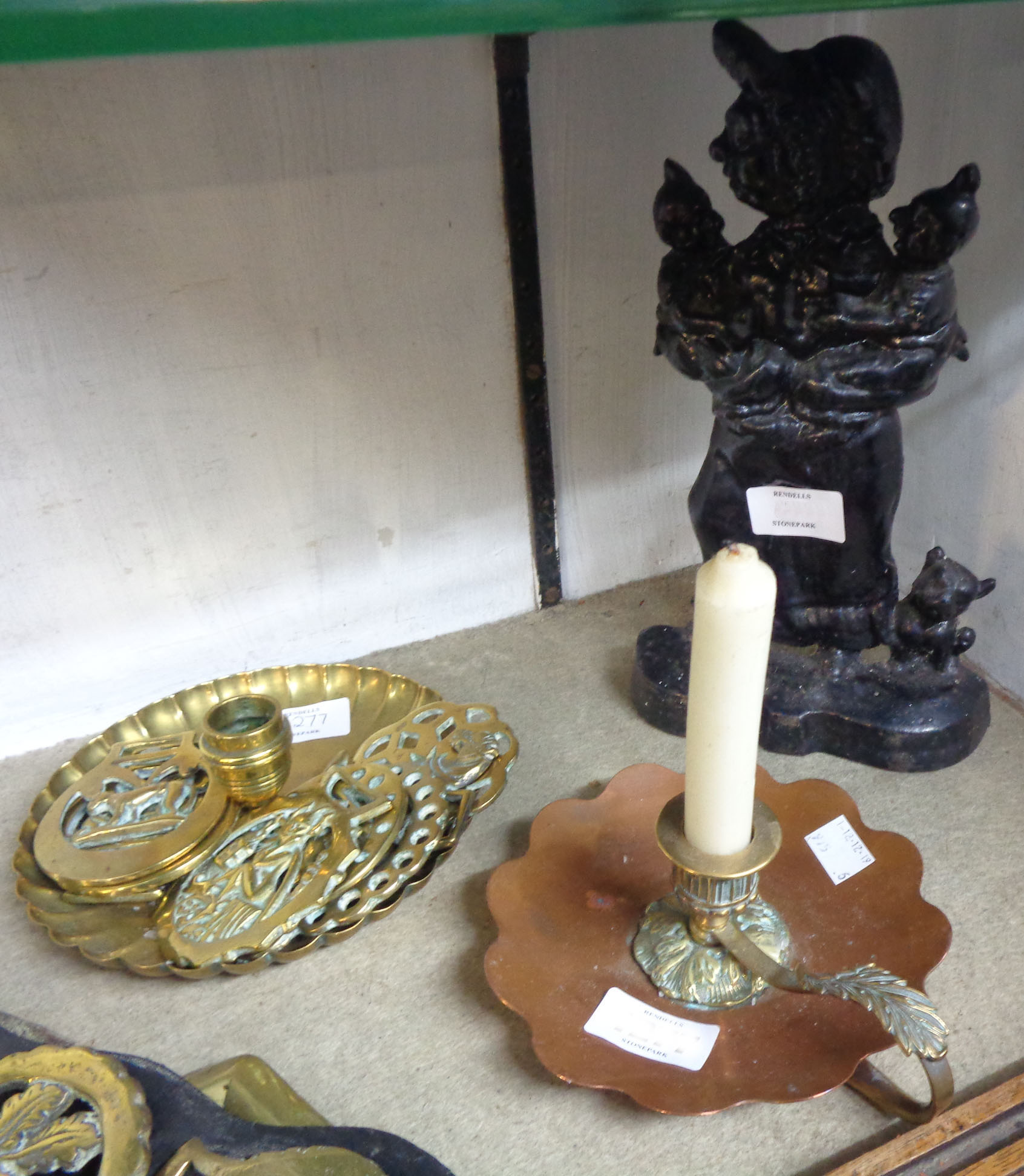 Various horse brasses, candlestick and a Judy pattern door stop