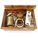 A bamboo box containing a quantity of assorted costume jewellery