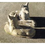 A pair of concrete garden dogs