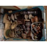 A box containing architectural salvage including handles and finials