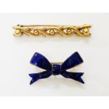 A marked "18" yellow metal bar brooch - sold with a gilt metal and enamelled bow pattern brooch