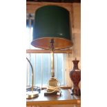 A column pattern table lamp with green and gilt shade