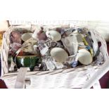 A painted wicker hamper containing a set of six French cups and saucers