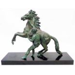 After Coustou: a spelter Marly horse statue with remains of verdigris finish, on composite plinth