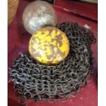 Two cannon balls and a panel of chain mail