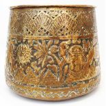 An Egyptian brass jardinière with pierced and embossed decoration