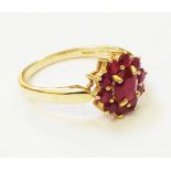 A hallmarked 585 gold ruby cluster ring