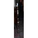 A late 20th Century brassed metal and onyx standard lamp with shade