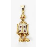 A marked 375 yellow metal clown pattern pendant with jointed limbs and head, encrusted with small