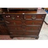 A 3' 8" late Georgian solid oak Jacobean style chest of two short and three long graduated