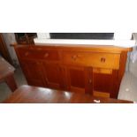 A 6' 3" Victorian polished pine dresser base with two frieze drawers and two pairs of panelled