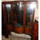 A 3' 11" Edwardian inlaid mahogany break bow front display cabinet with adapted mirror set back