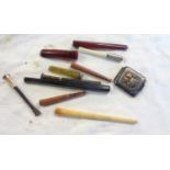 A collection of assorted cigarette holders, etc.