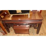 A 3' 2" Chinese rosewood table with bracketed top and decorative pierced apron, set on moulded