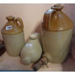 Two stoneware flagons ad a hot water bottle