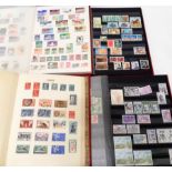 Three stock books containing 20th Century commemorative and other stamps - sold with an album of