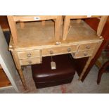 A 36" antique pine simulated bamboo kneehole table with frieze drawer and flanking double fronted