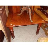 A Victorian mahogany extending dining table with single leaf, set on turned and fluted legs with