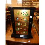 A 12" modern Oriental lacquered jewellery cabinet with four drawers to front and flanking necklace