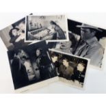 Three unframed monochrome photographs depicting James Stewart comprising a 1940 wartime group, a