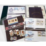 An album of FDC's, mint GB decimal stamps and Diego Garcia writing set, etc.