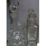 A pair of spirit decanters and a pair of cut onion decanters