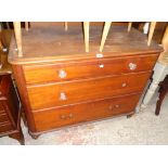 A 3' 7" Victorian pitch pine chest of three long graduated long drawers, set on turned feet