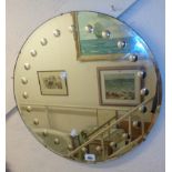 A 21 3/4" diameter 1960`s frameless bevelled wall mirror with convex bubble border