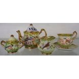 A china miniature tea set with bird decoration, hand painted and signed by R. Everill