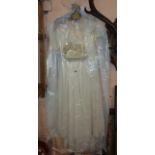 Three antique children's dresses, two petticoats, bonnet and knickers