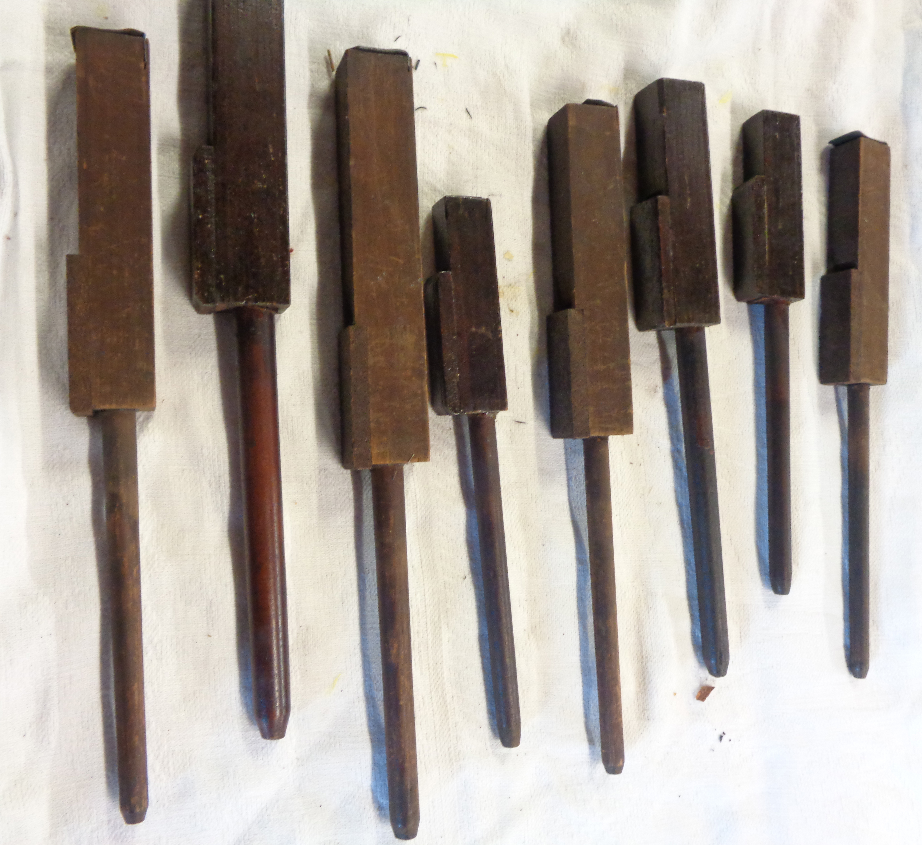 Eight old wood pedal organ pipes