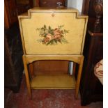 A 23" 1930`s decorative painted wood fall-front desk, set on square supports with undertier