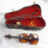 A miniature cello in hard case