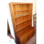 A 3' 6 1/2" retro teak effect bookcase/wall unit with five open shelves (one illuminated) and pair