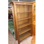A 3' 6" modern polished oak and mixed wood five shelf open bookcase in the Arts & Crafts style,