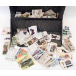 A file box containing a collection of loose cigarette cards, many part sets including John