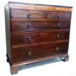 A 3' 5 1/2" late Georgian mahogany chest with secret frieze drawer over two short and three long