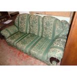 A 6' 3" three seater settee upholstered in green floral tapestry